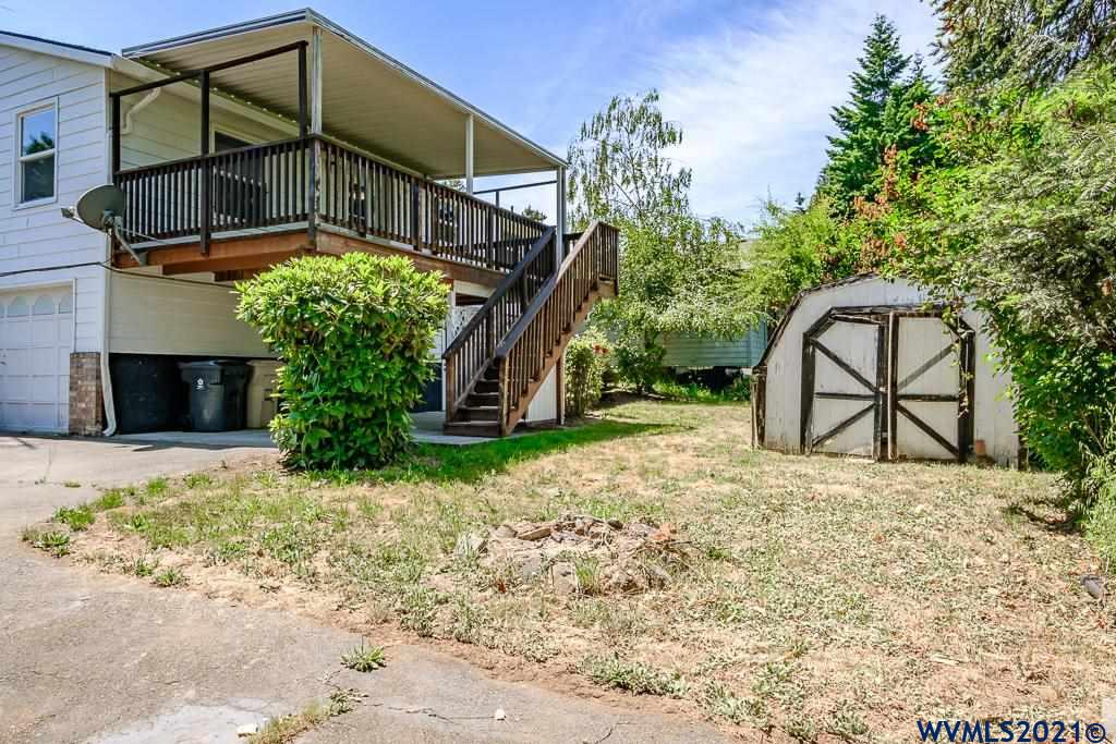 1278 Southwest Maple Street Dallas, OR 97338 - Photo 40 of 42 a backyard of a house with lots of green space