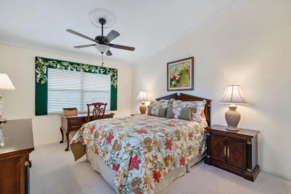 a bedroom with bed and window