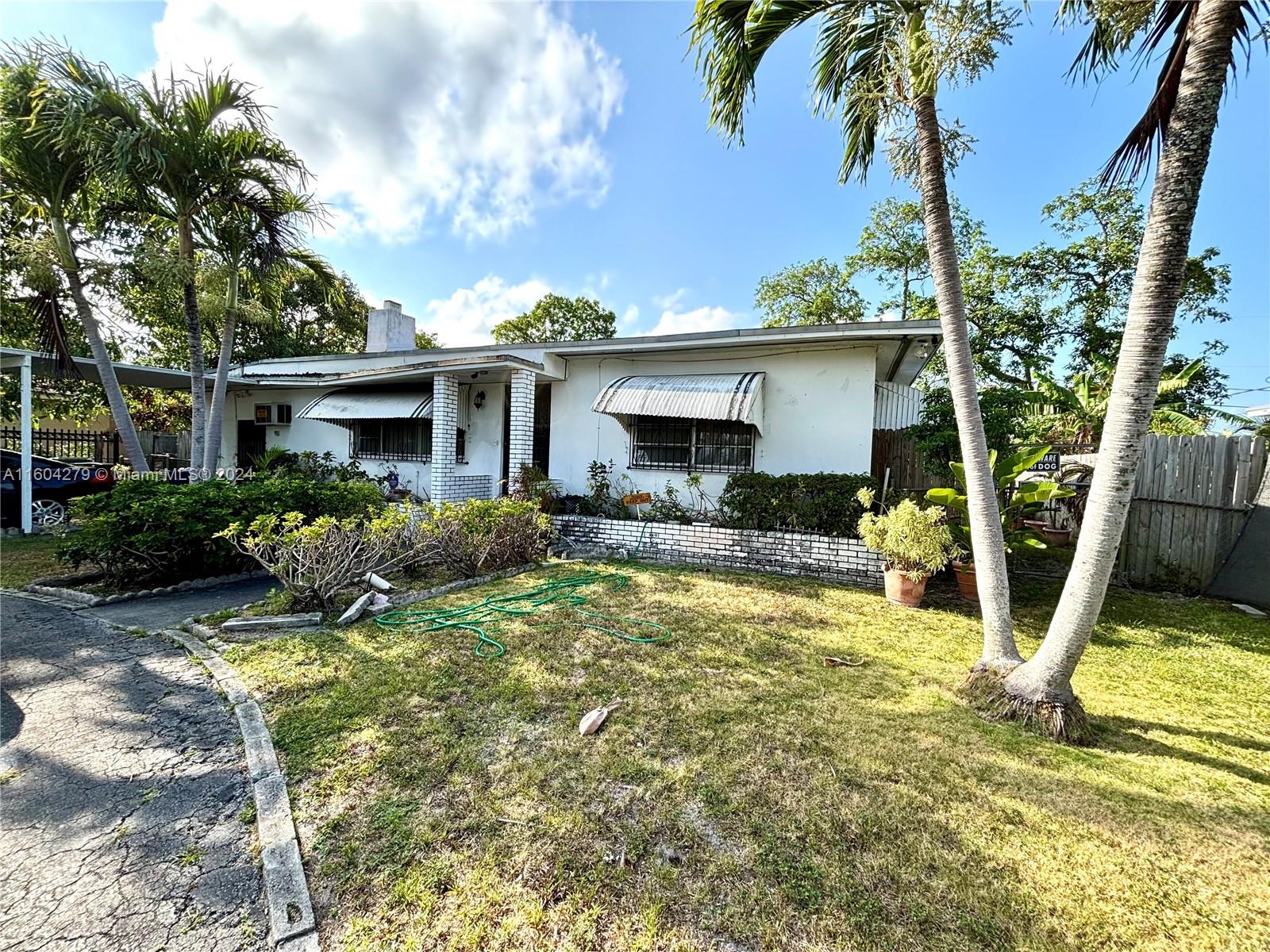 911 Northwest 138th Street Miami, FL 33168 - Photo 3 of 14 a view of a house with backyard and sitting area