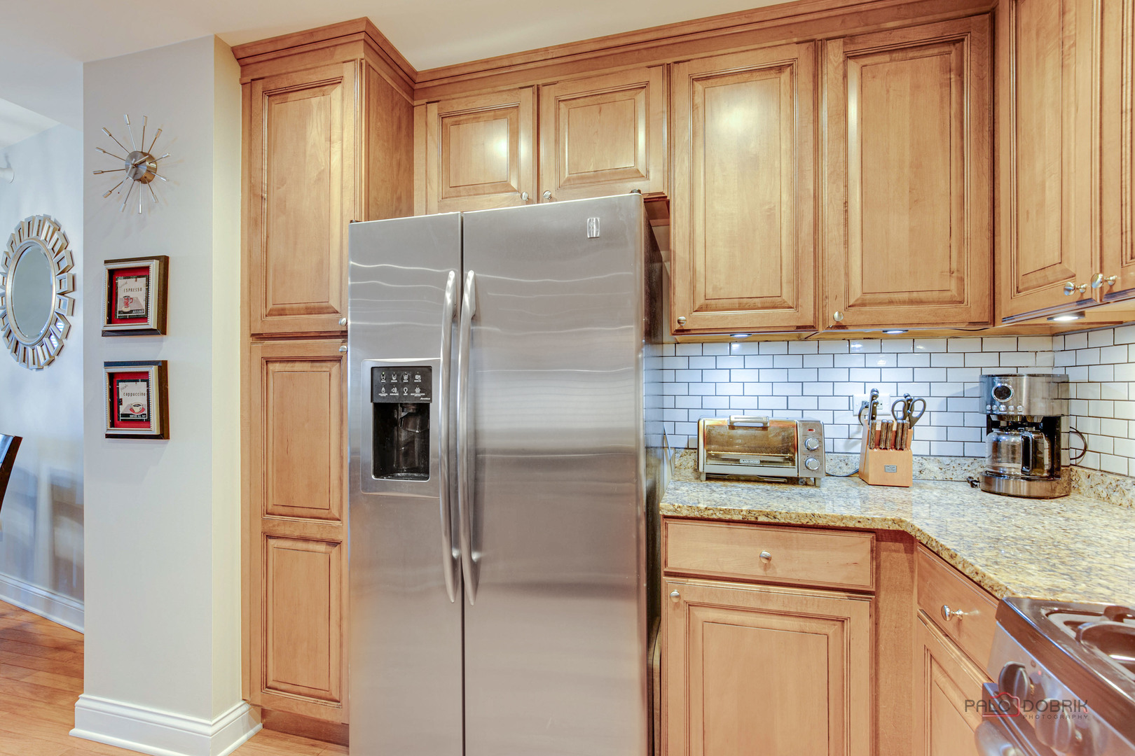 125 North Buffalo Grove Road, Unit 306 Buffalo Grove, IL 60089 - Photo 12 of 19 a kitchen with refrigerator and cabinets
