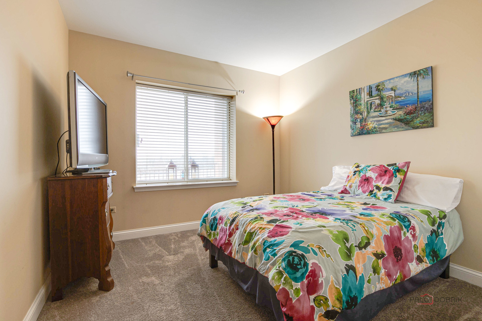 125 North Buffalo Grove Road, Unit 306 Buffalo Grove, IL 60089 - Photo 15 of 19 a bedroom with a bed and a window