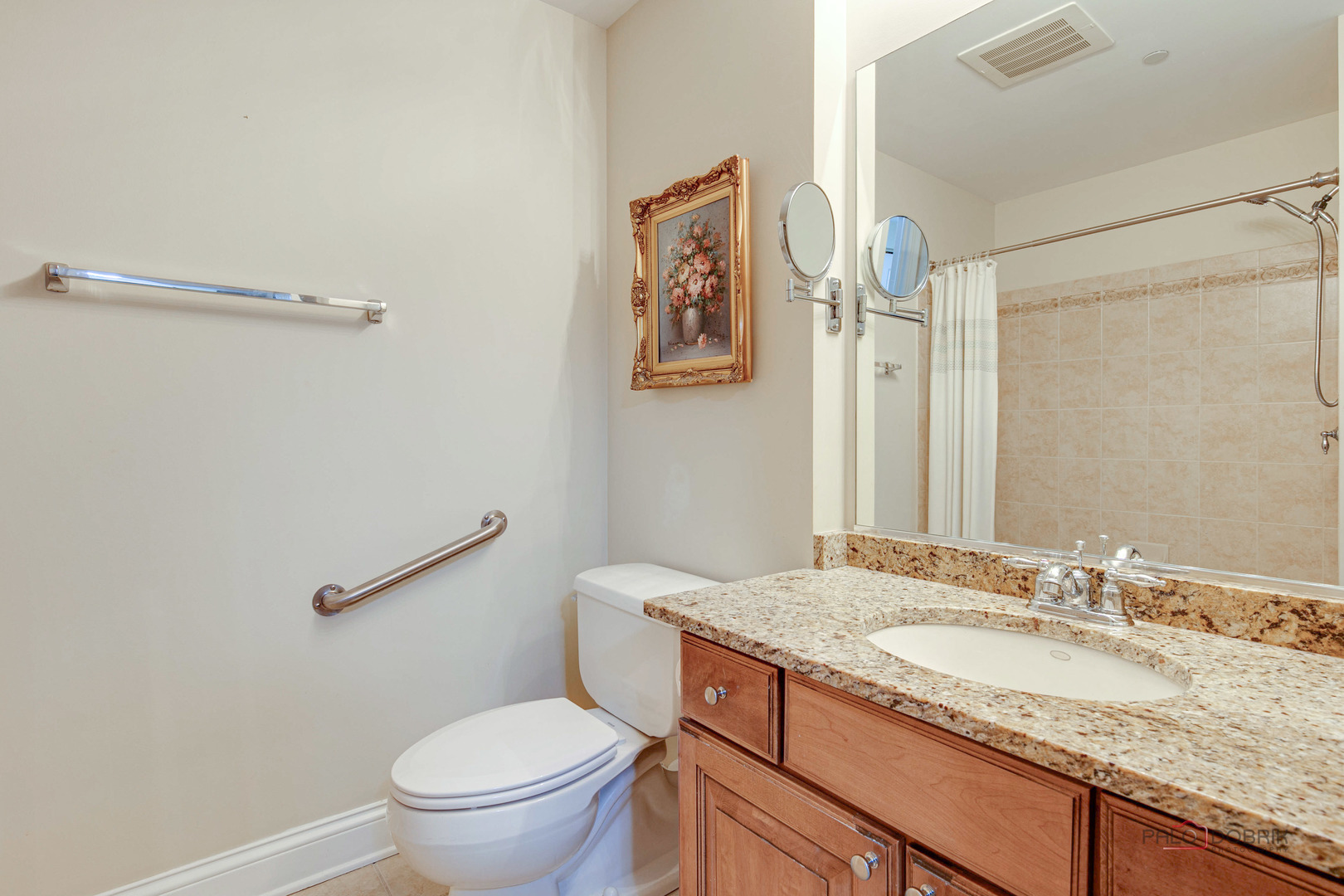 125 North Buffalo Grove Road, Unit 306 Buffalo Grove, IL 60089 - Photo 16 of 19 a bathroom with a granite countertop sink toilet and a mirror