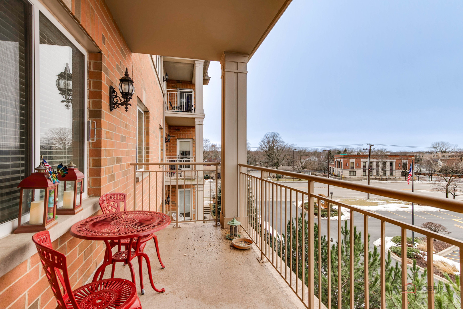 125 North Buffalo Grove Road, Unit 306 Buffalo Grove, IL 60089 - Photo 18 of 19 a view of a balcony with chairs and a table
