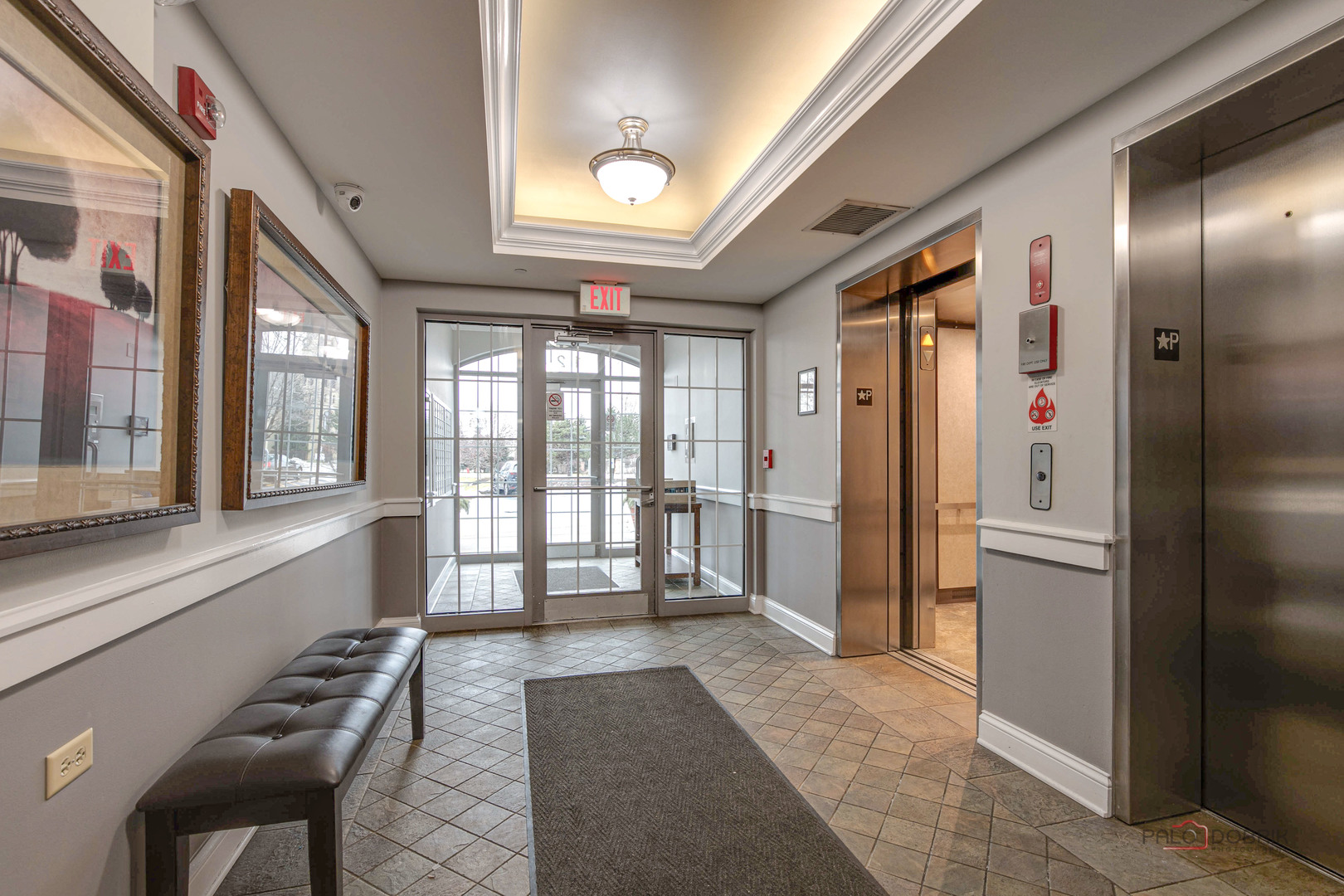 125 North Buffalo Grove Road, Unit 306 Buffalo Grove, IL 60089 - Photo 3 of 19 a view of a hallway with furniture and a large window