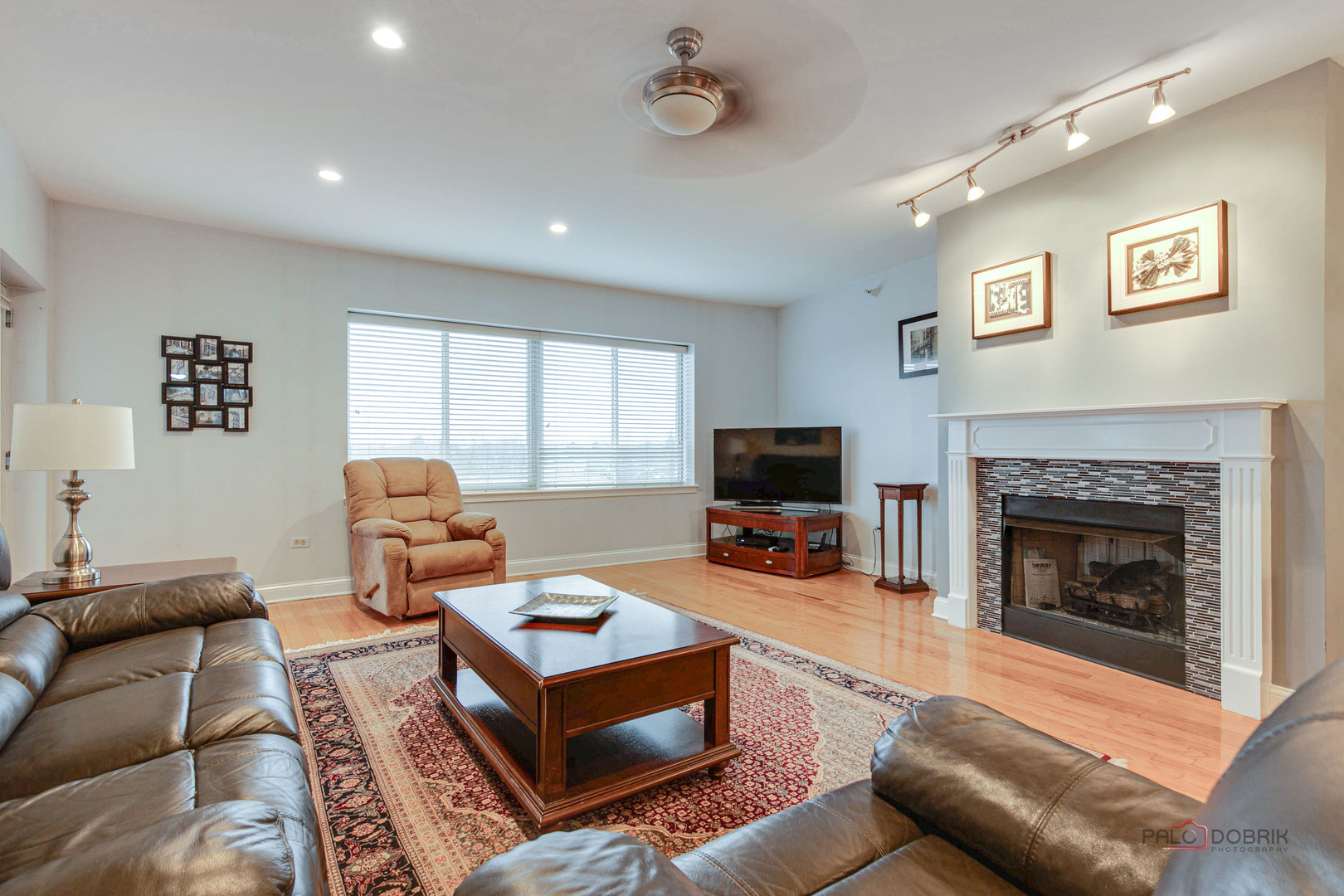 125 North Buffalo Grove Road, Unit 306 Buffalo Grove, IL 60089 - Photo 6 of 19 a living room with furniture a flat screen tv and a fireplace
