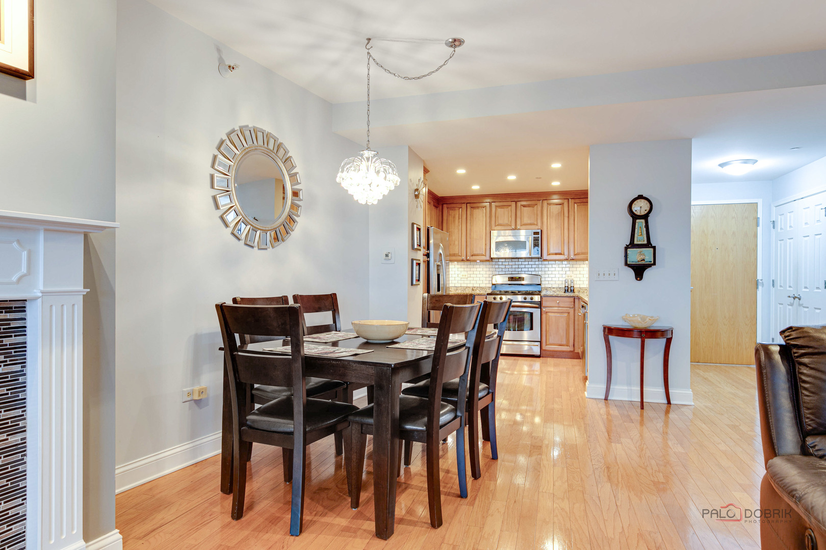 125 North Buffalo Grove Road, Unit 306 Buffalo Grove, IL 60089 - Photo 9 of 19 a view of a dining room with furniture and wooden floor