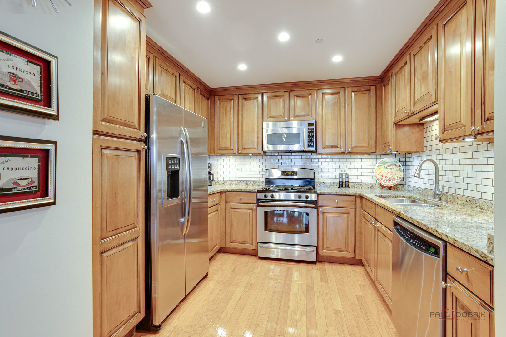 125 North Buffalo Grove Road, Unit 306 Buffalo Grove, IL 60089 - Photo 10 of 19 a kitchen with stainless steel appliances granite countertop a refrigerator sink and stove