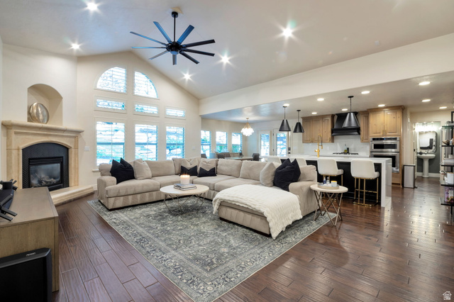 577 South Ridge Top Lane East North Salt Lake, UT 84054 - Photo 4 of 57 Expansive gathering space highlighted by soaring ceilings, hardwood floors, and beautiful views of the surrounding mature landscape.