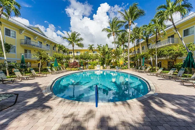 a view of a swimming pool with a patio