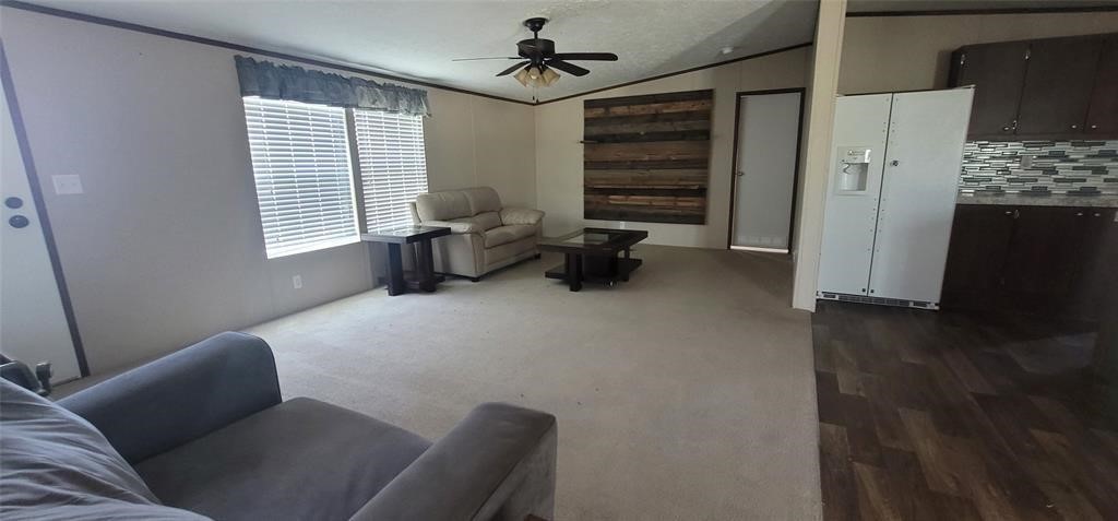 28625 Clay Road, Unit C Katy, TX 77493 - Photo 10 of 18 a living room with furniture and a chandelier