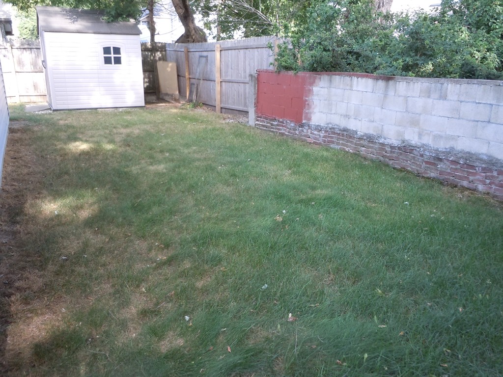 41 Blodgett Street Springfield, MA 01108 - Photo 23 of 23 a view of backyard with deck and garden