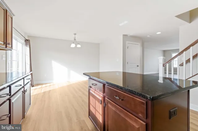 a view of cabinets and wooden floor