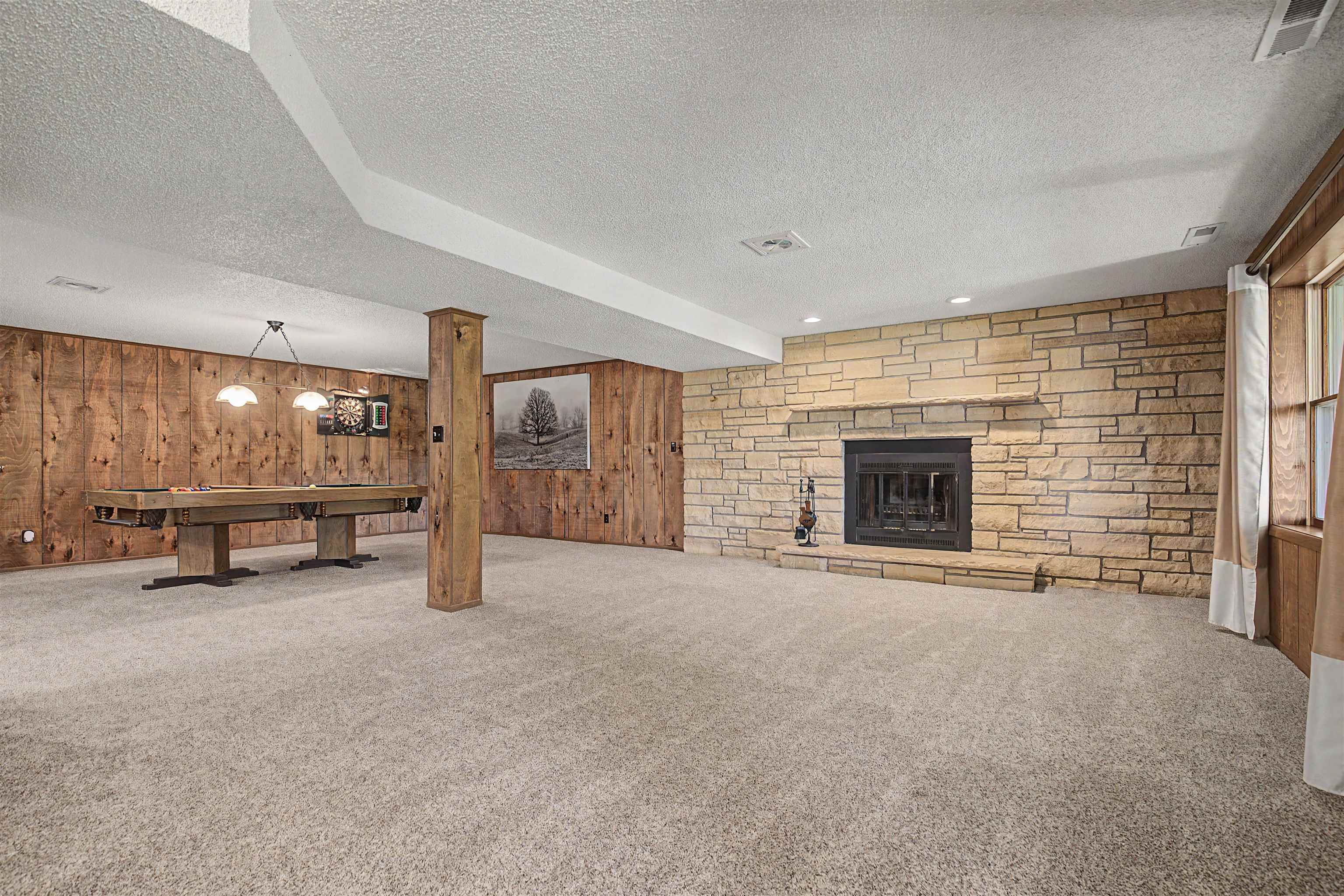 17380 Corbett Road Mount Carroll, IL 61053 - Photo 28 of 65 an empty room with furniture and a fireplace