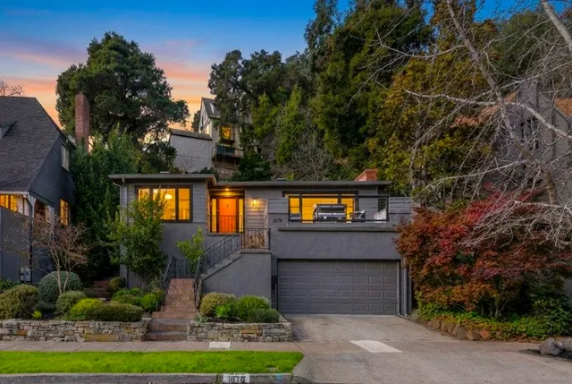 a front view of a house with garden