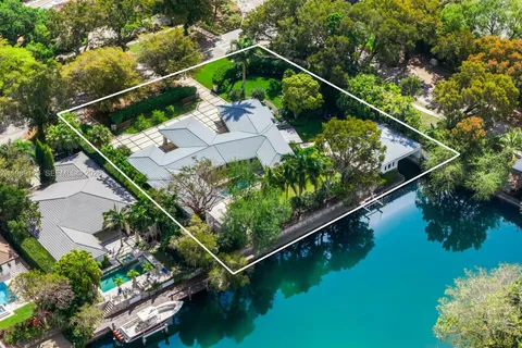 an aerial view of house with yard swimming pool and outdoor seating