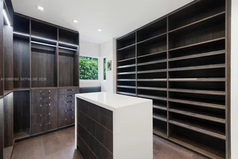 a view of an empty room with empty shelves