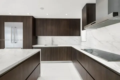 a kitchen with a sink and cabinets