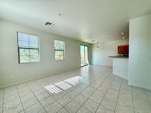 a view of an empty room and window