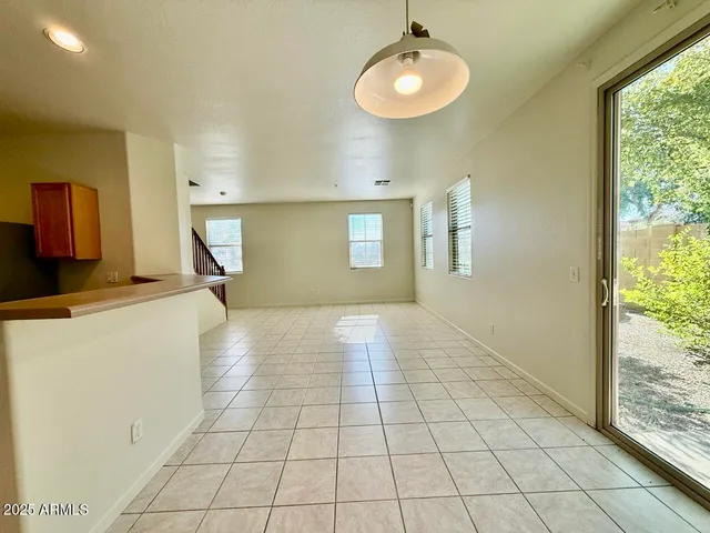 a view of a kitchen with a sink and a window