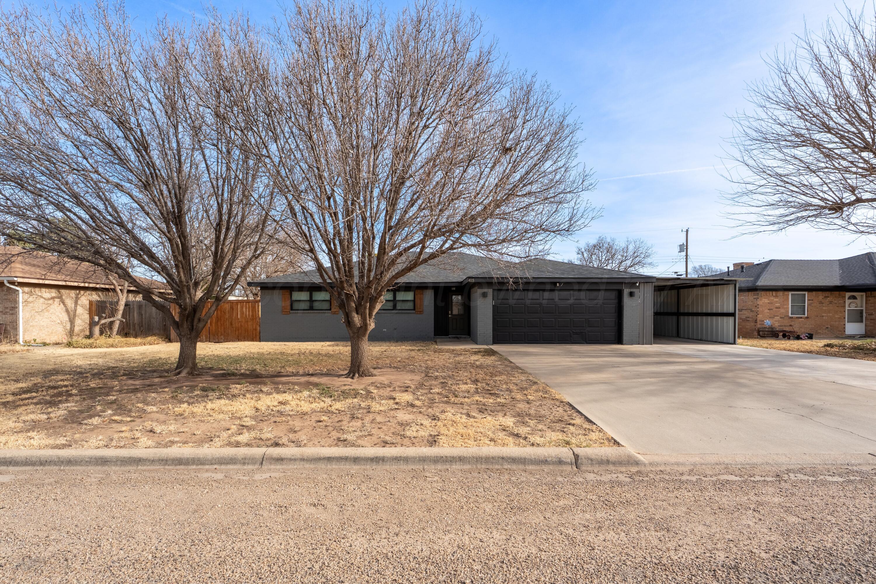 415 Mustang Street Fritch, TX 79036 - Photo 1 of 23 a front view of house with yard