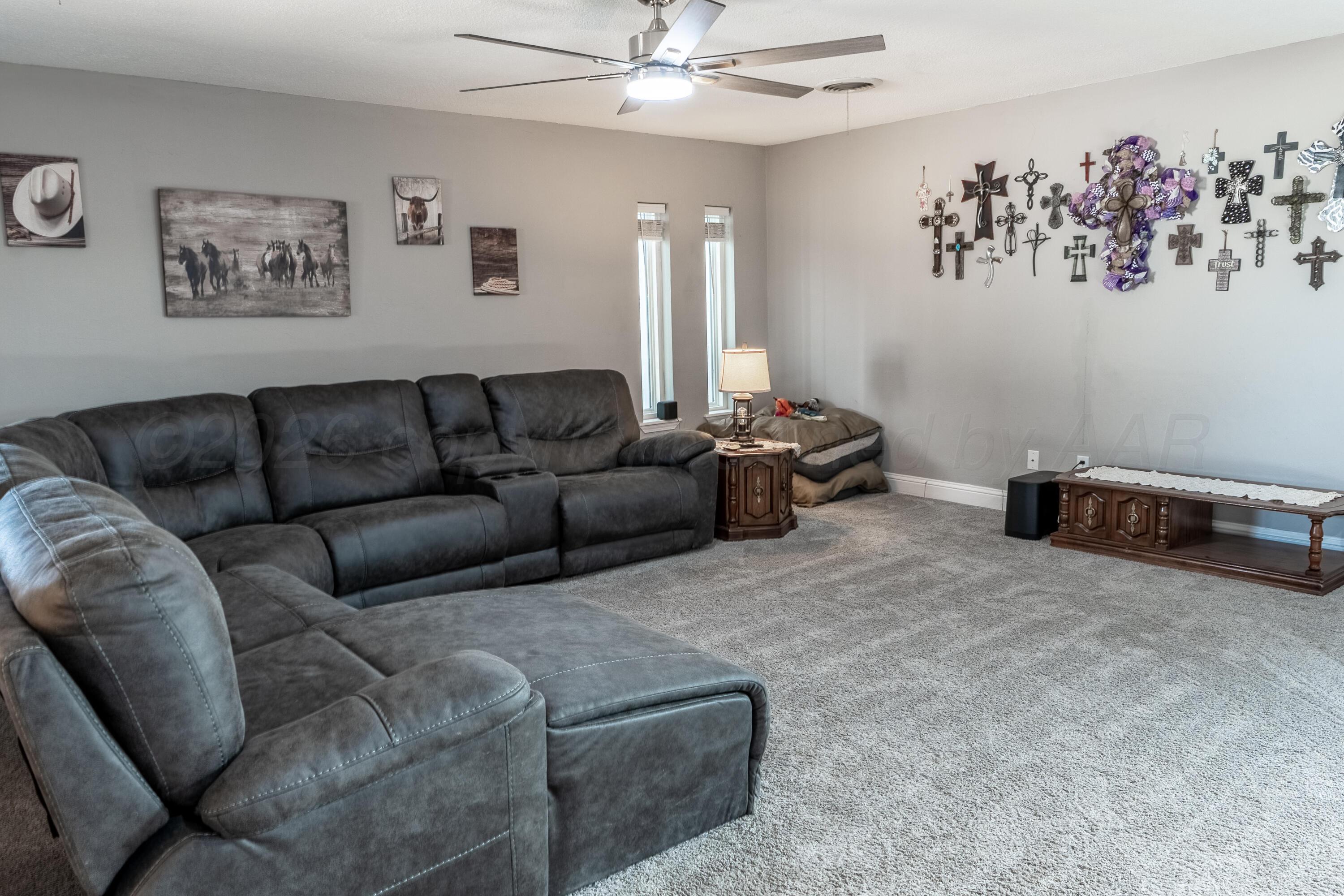 415 Mustang Street Fritch, TX 79036 - Photo 11 of 23 a living room with furniture and a couch