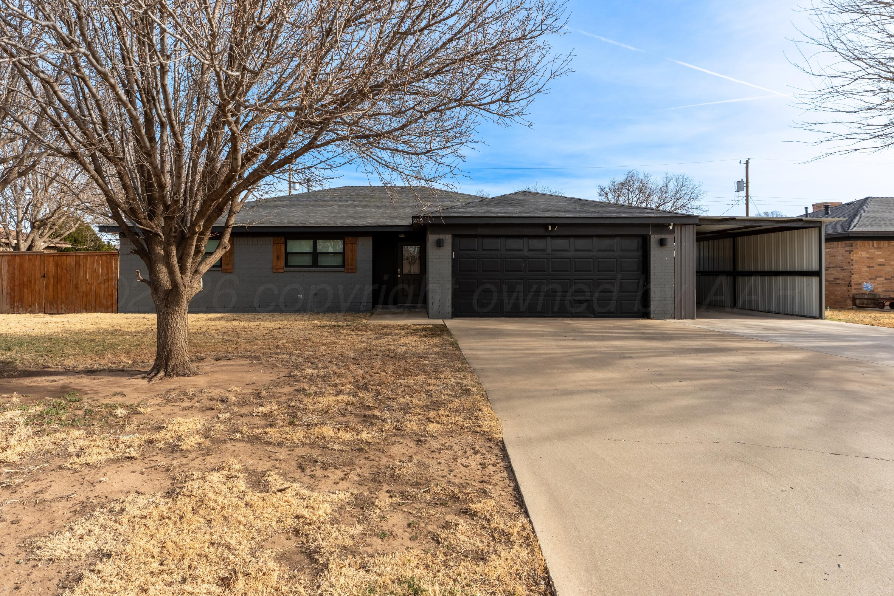 415 Mustang Street Fritch, TX 79036 - Photo 4 of 23 a house with trees in front of it