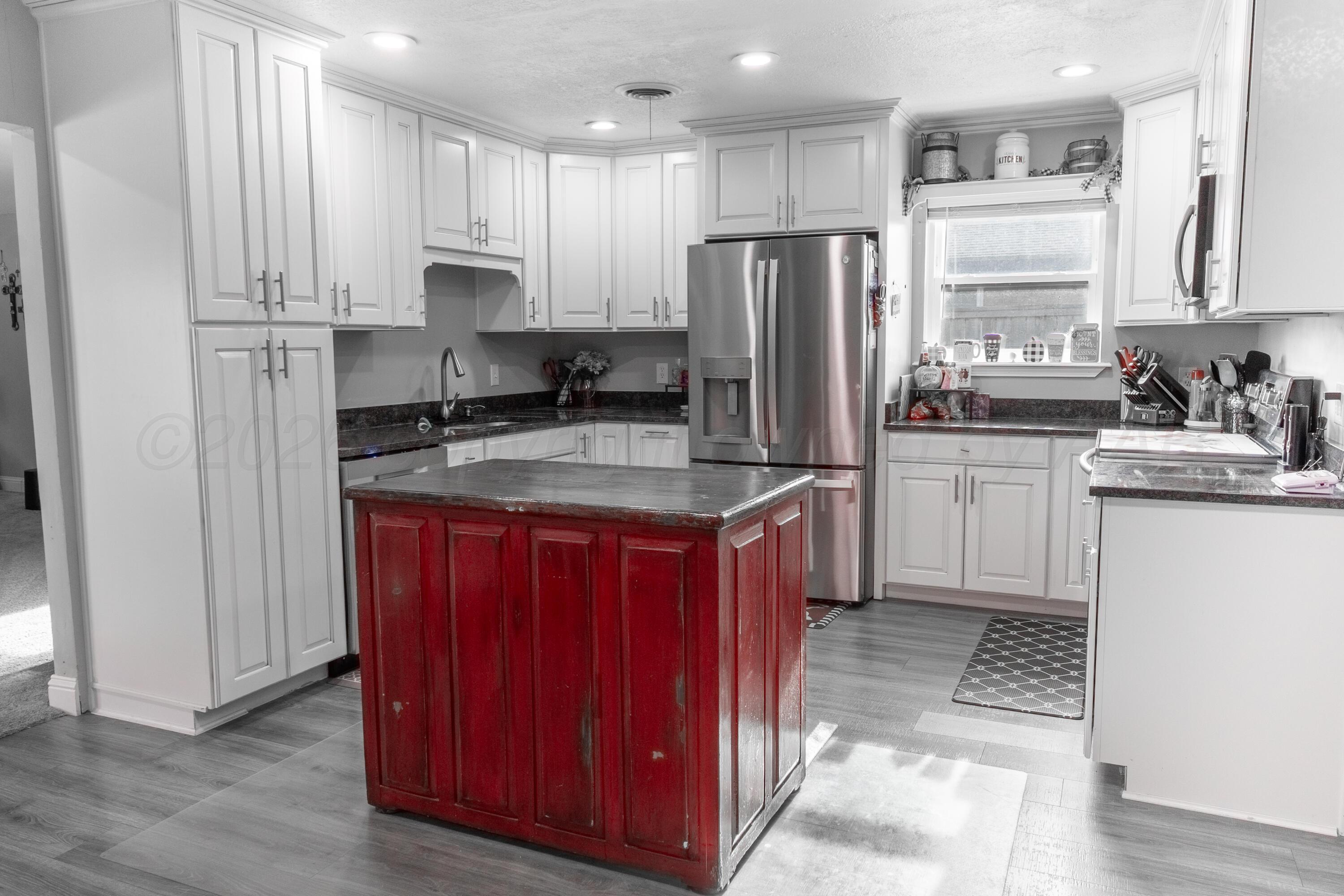 415 Mustang Street Fritch, TX 79036 - Photo 8 of 23 a kitchen with stainless steel appliances granite countertop a refrigerator and a stove top oven