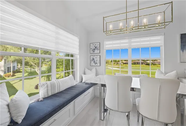 a kitchen with stainless steel appliances a stove a sink island and a refrigerator