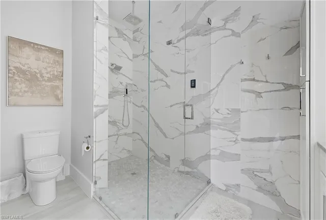 a bathroom with a double vanity sink mirror and bathtub