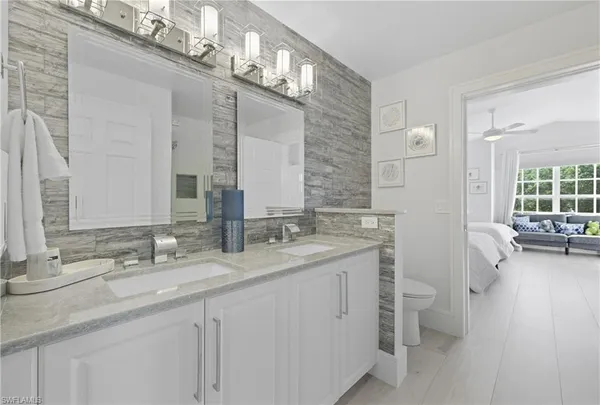 a bedroom with two beds and a couch