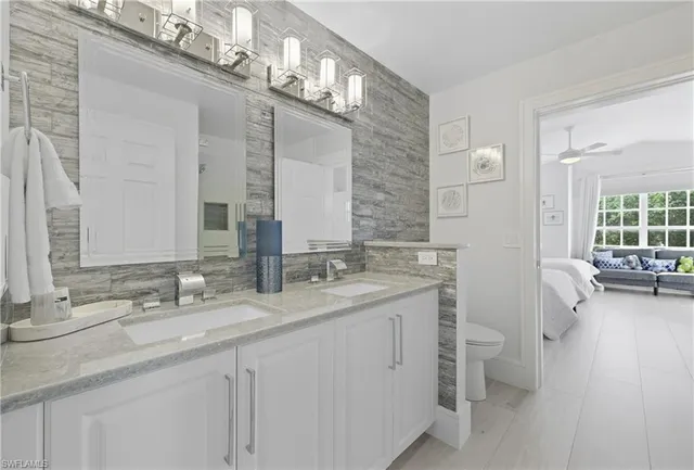 a bedroom with two beds and a couch