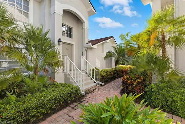a view of a street with plants