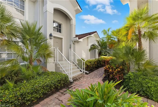 a view of a street with plants