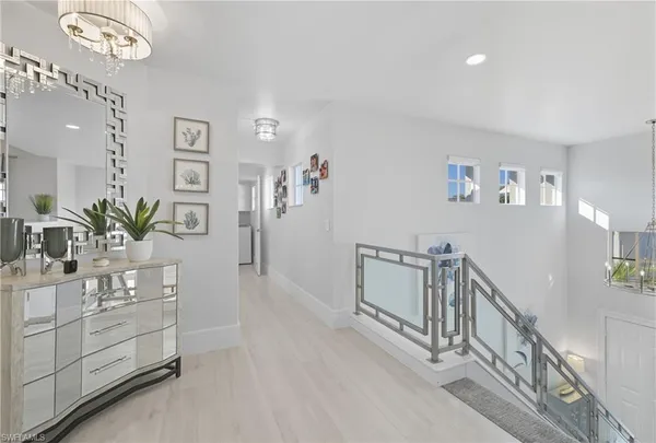 a living room with furniture and a lamp