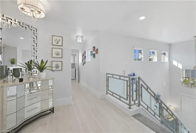 a living room with furniture and a lamp