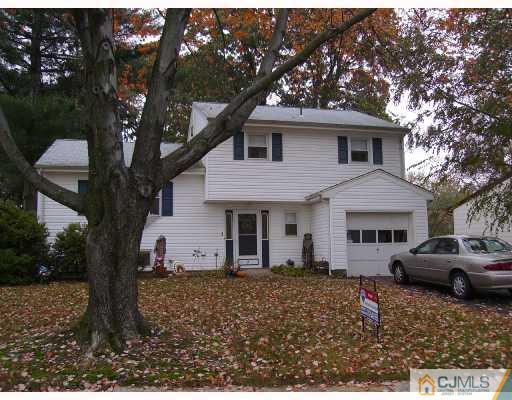 13 Magee Road Edison, NJ 08817 - Photo 1 of 7 a front view of a house with a yard