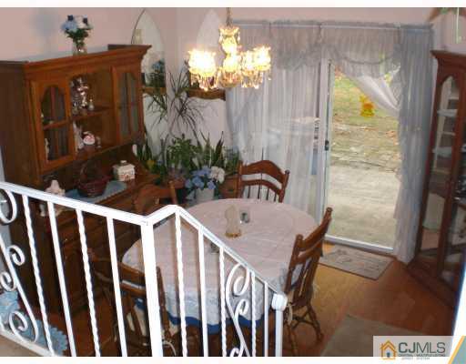 13 Magee Road Edison, NJ 08817 - Photo 2 of 7 a view of a dining room with furniture window and wooden floor