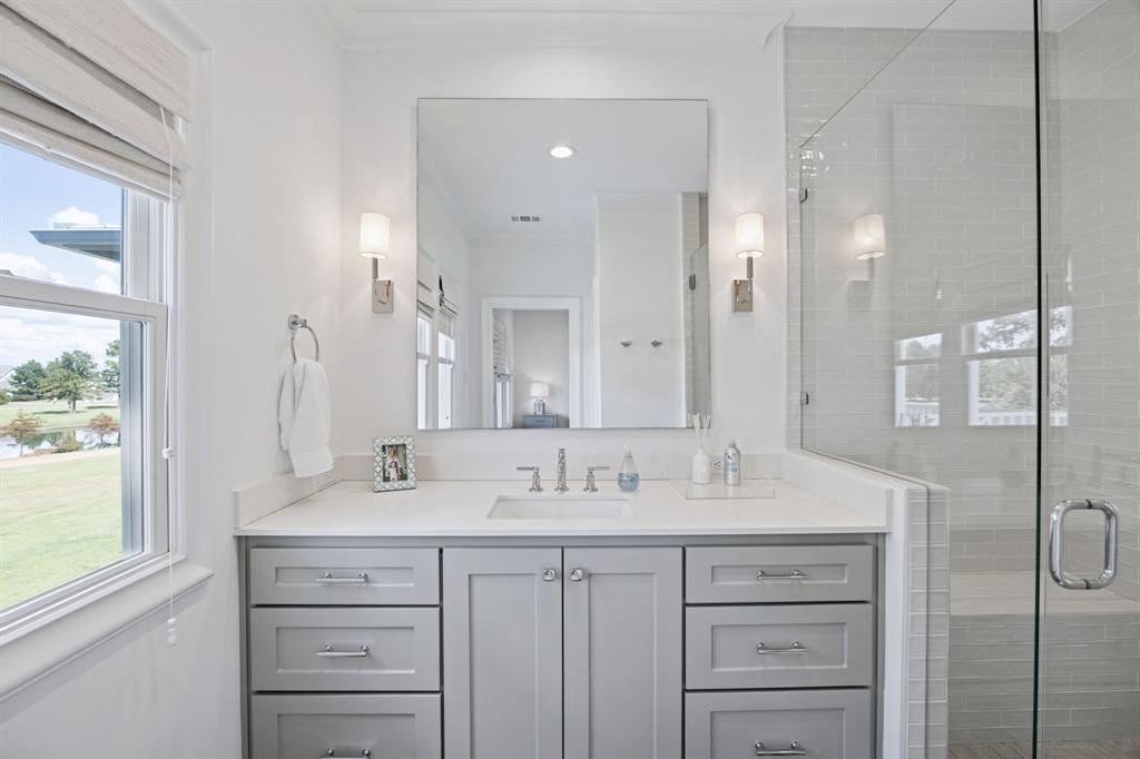 13450 Shumate Way Malakoff, TX 75148 - Photo 24 of 40 a bathroom with a sink double vanity and a mirror