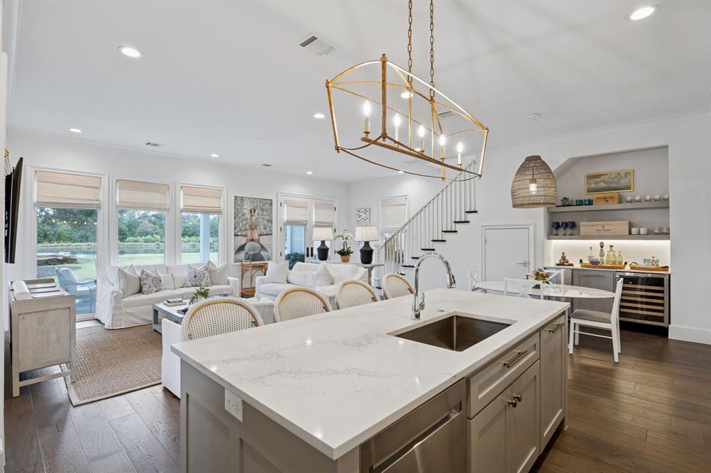 13450 Shumate Way Malakoff, TX 75148 - Photo 6 of 40 a large kitchen with stainless steel appliances kitchen island a large counter top a stove and a chandelier