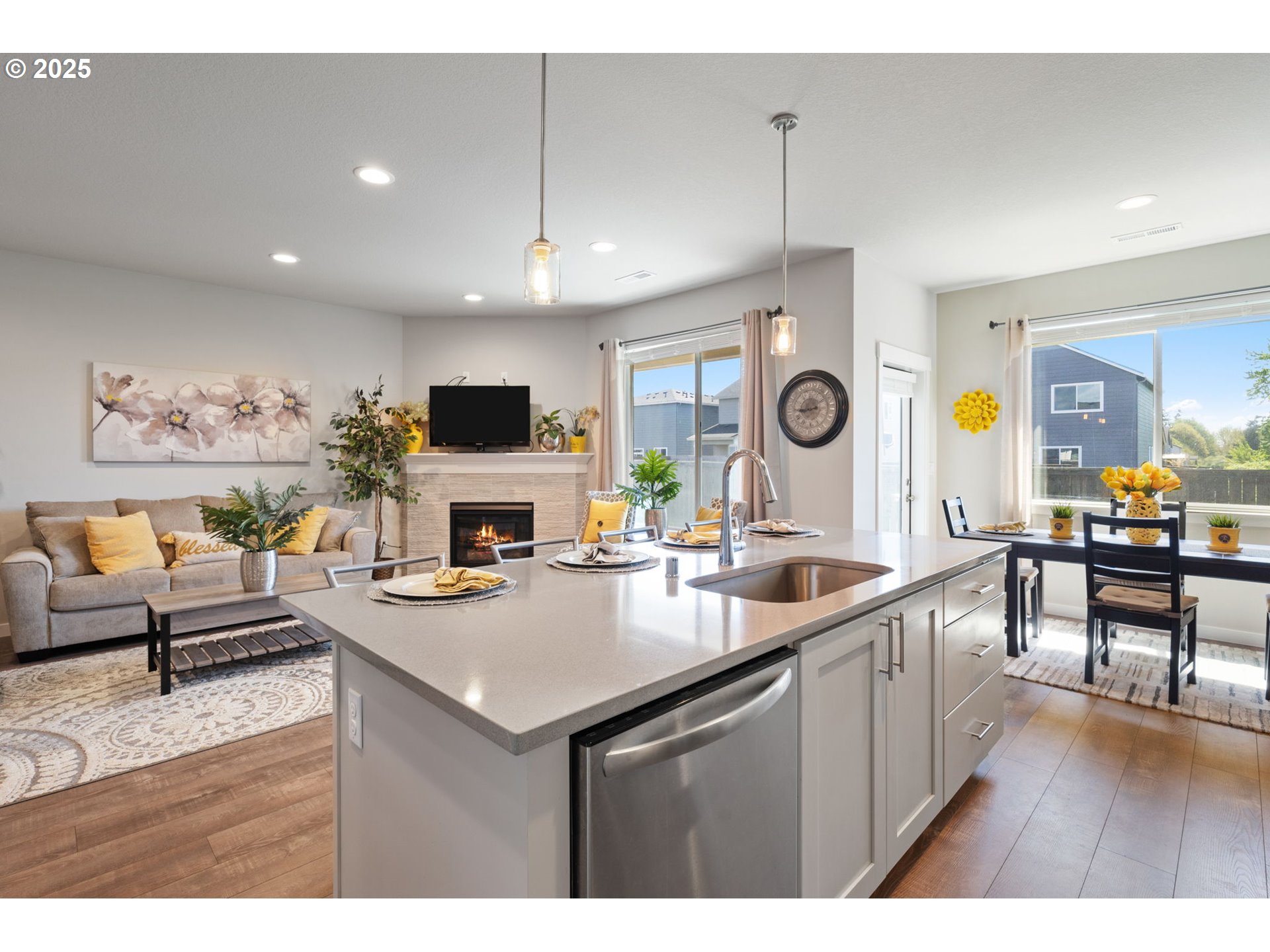 8707 North 1st Street Ridgefield, WA 98642 - Photo 13 of 40 a open kitchen with stainless steel appliances granite countertop a stove and a sink with dishwasher