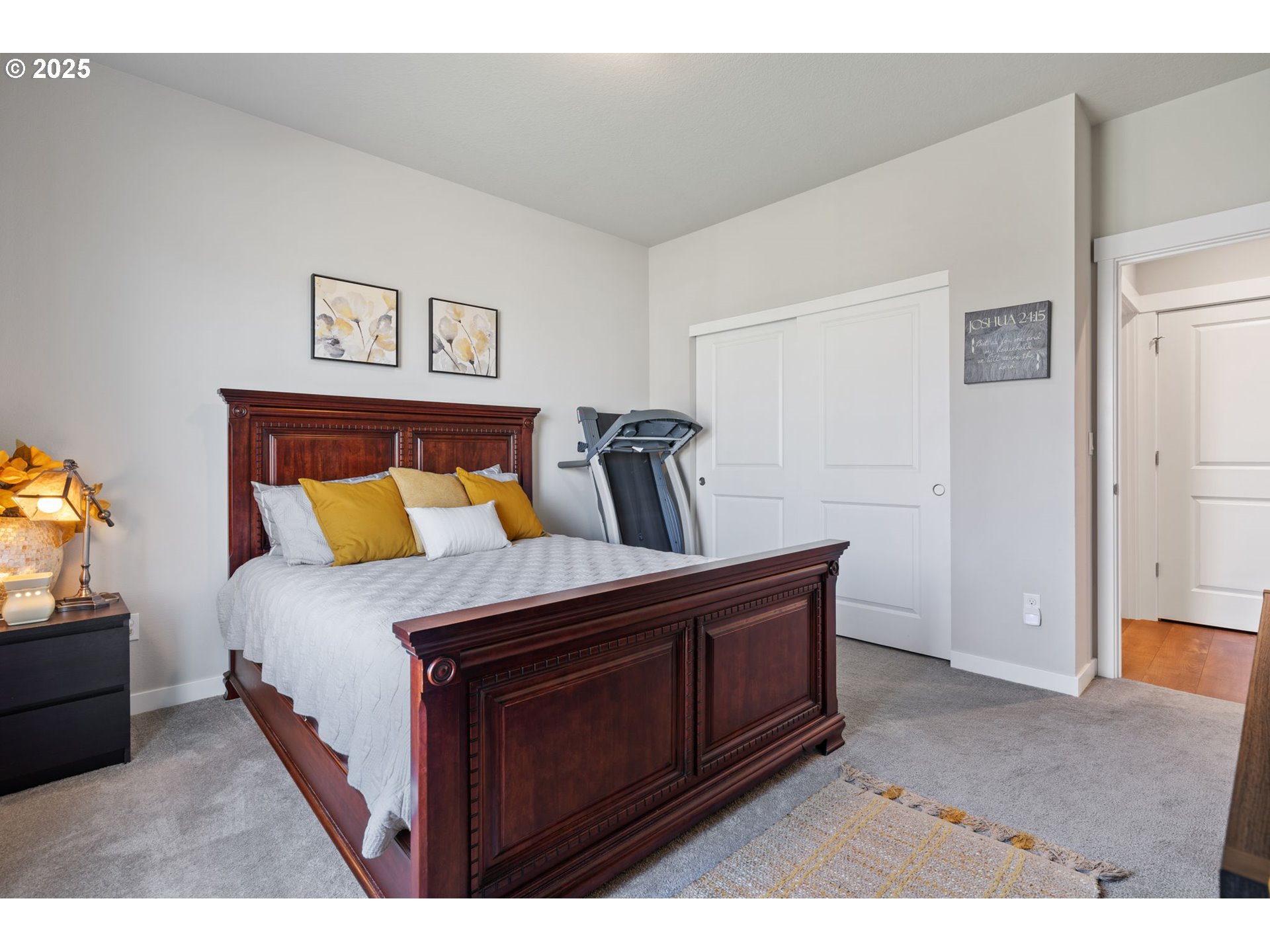 8707 North 1st Street Ridgefield, WA 98642 - Photo 17 of 40 a bed room with a bed and a television