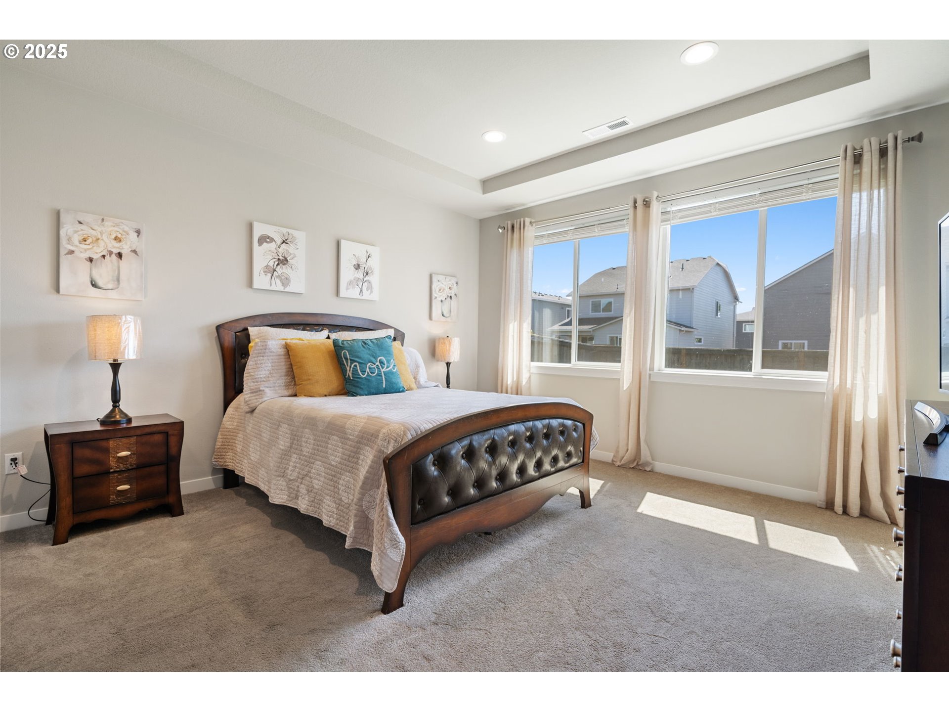 8707 North 1st Street Ridgefield, WA 98642 - Photo 19 of 40 a bedroom with a bed window and a table