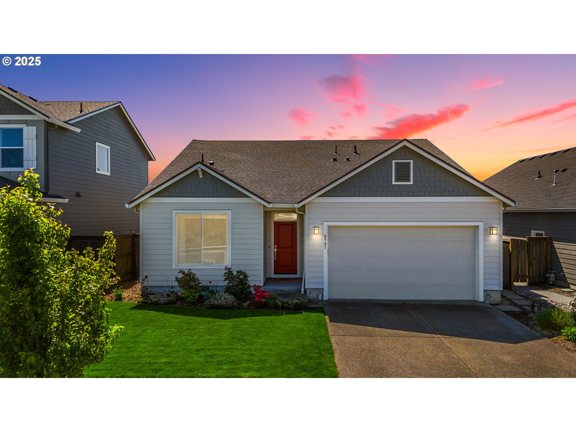 8707 North 1st Street Ridgefield, WA 98642 - Photo 2 of 40 a black and white house with a yard