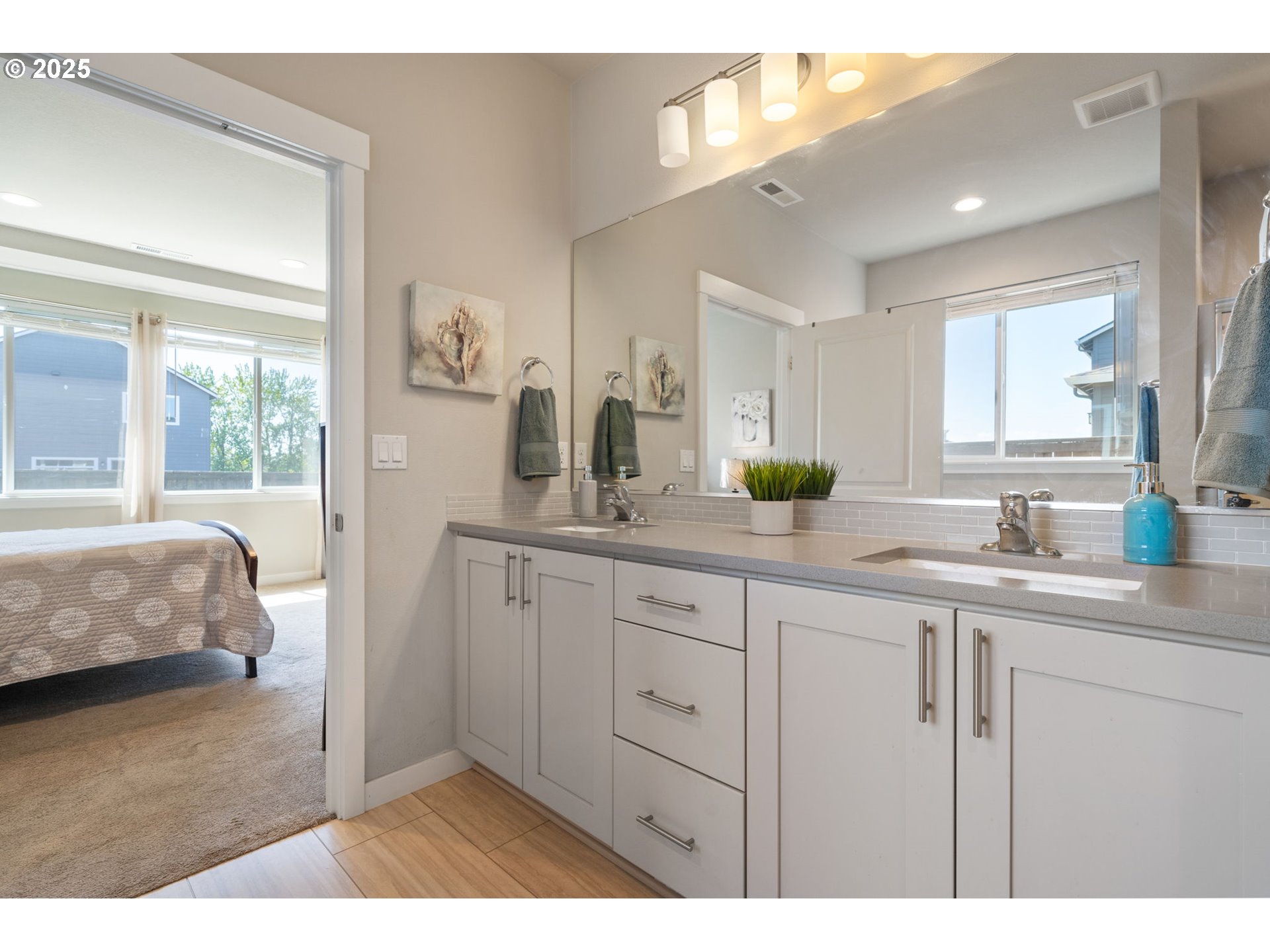 8707 North 1st Street Ridgefield, WA 98642 - Photo 23 of 40 a bathroom with a sink double vanity granite and a mirror