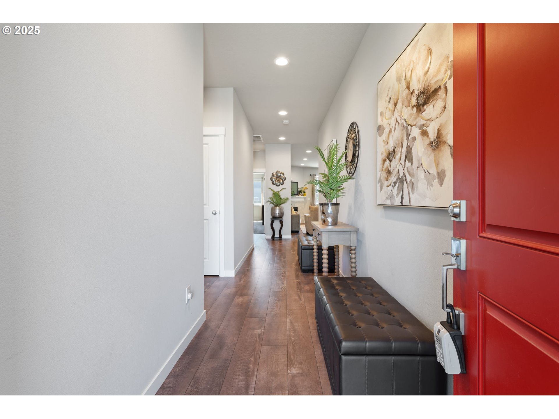 8707 North 1st Street Ridgefield, WA 98642 - Photo 3 of 40 a view of entryway with livingroom and wooden floor