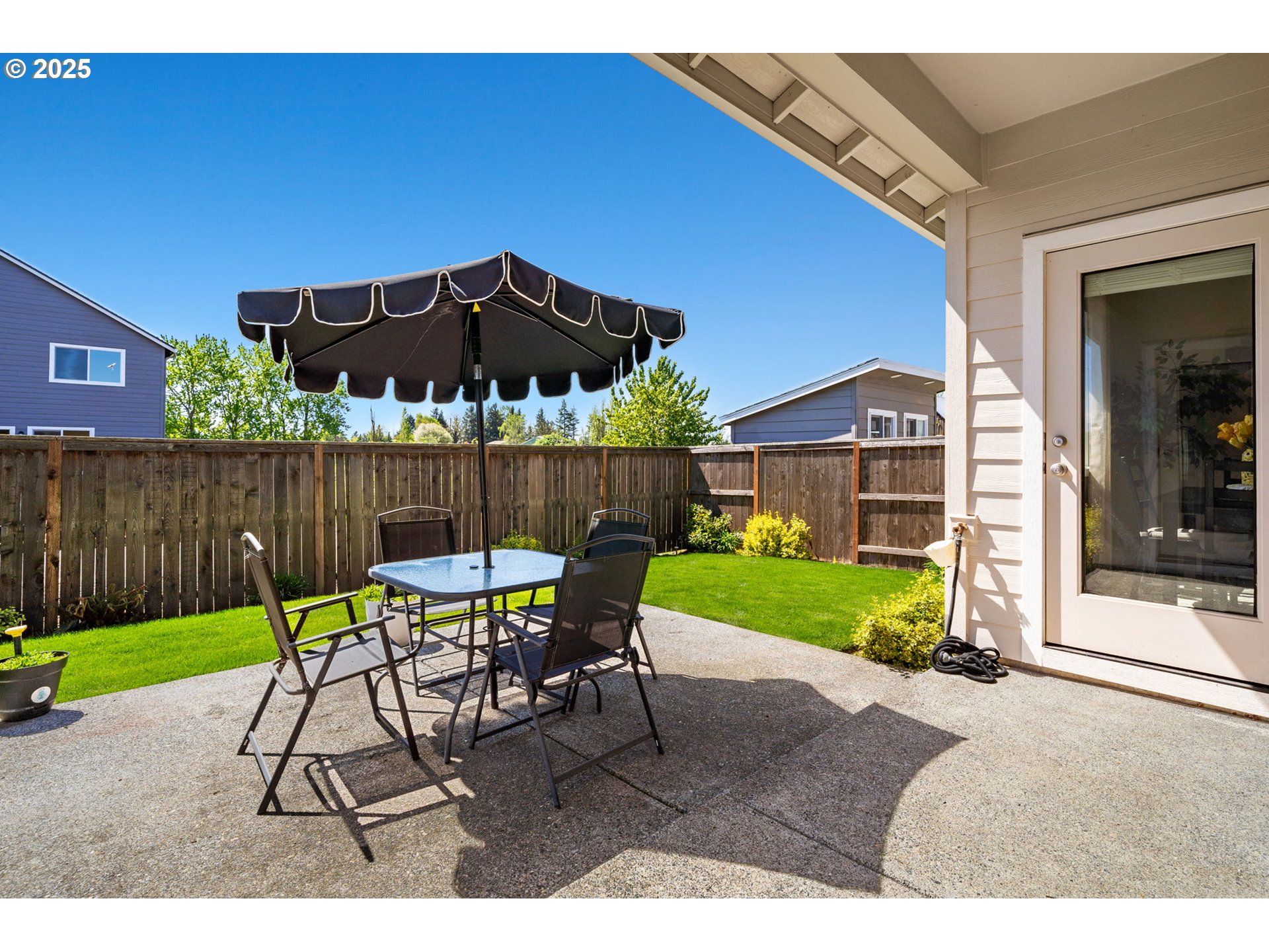 8707 North 1st Street Ridgefield, WA 98642 - Photo 32 of 40 a view of a chair and table in the backyard
