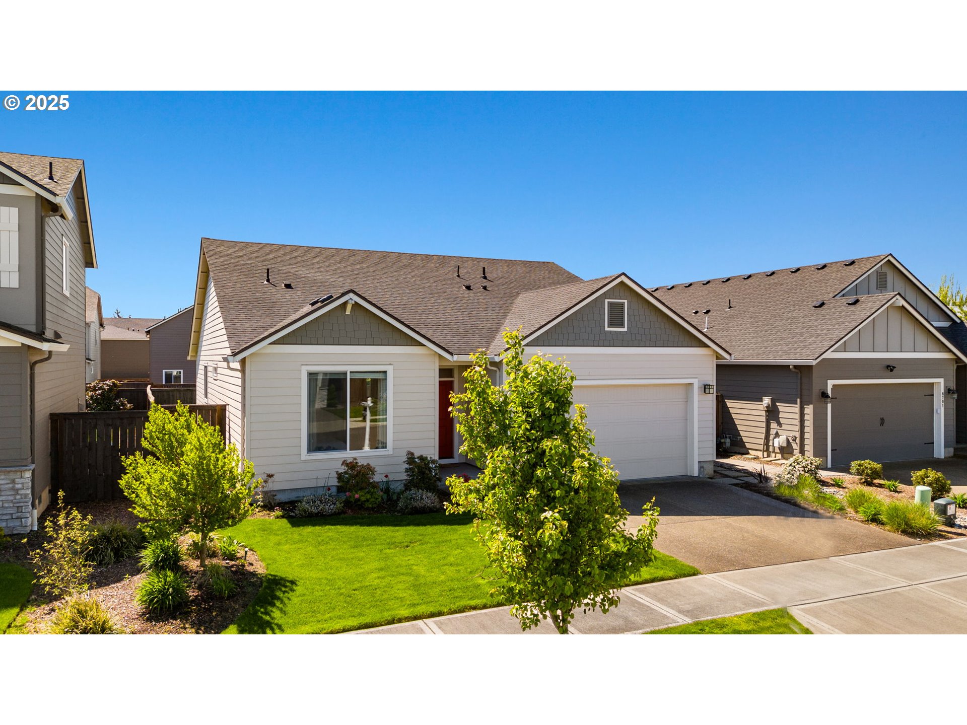 8707 North 1st Street Ridgefield, WA 98642 - Photo 39 of 40 a view of a house with a small yard and potted plants