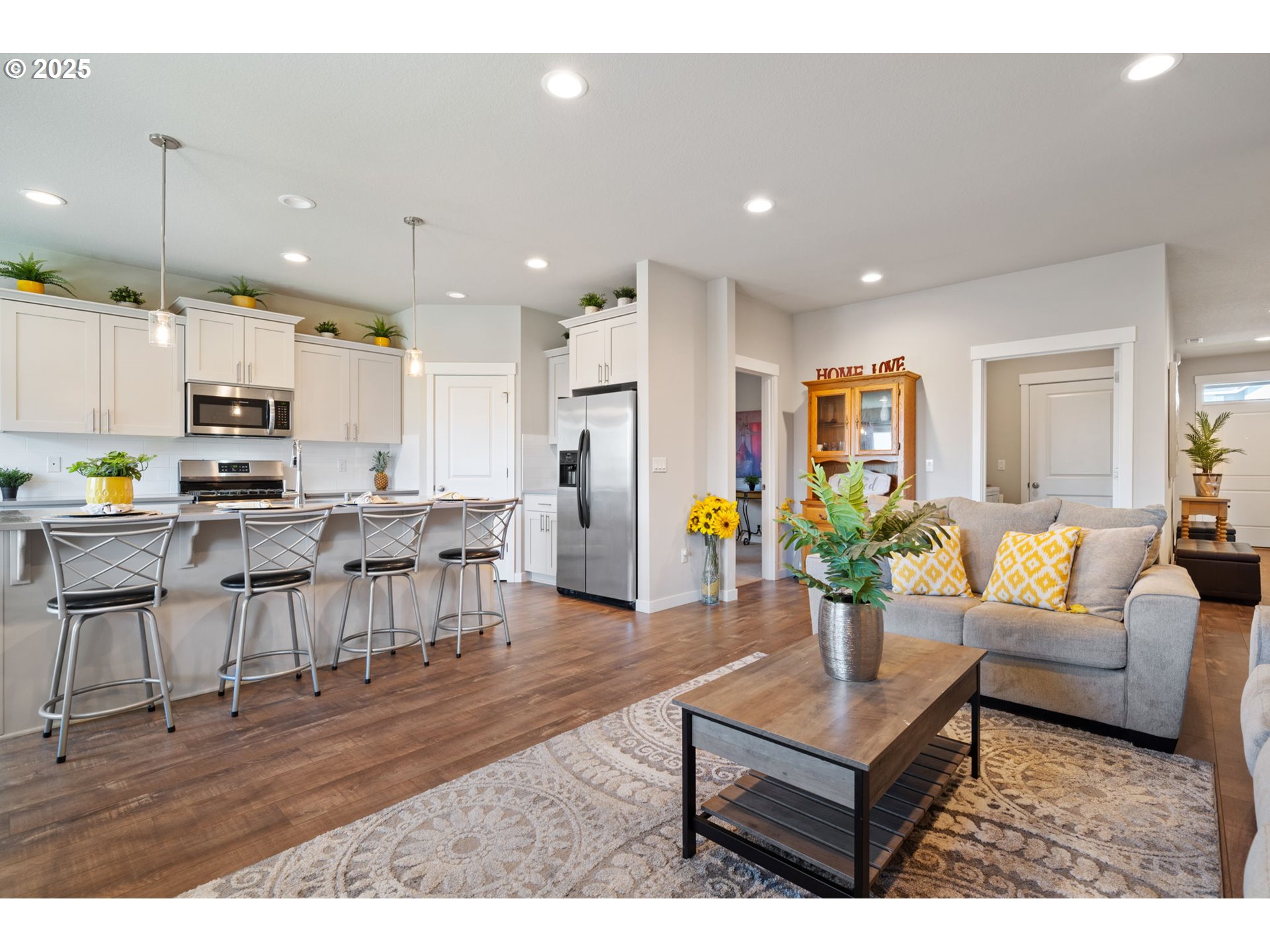 8707 North 1st Street Ridgefield, WA 98642 - Photo 7 of 40 a living room with lots of furniture and kitchen view