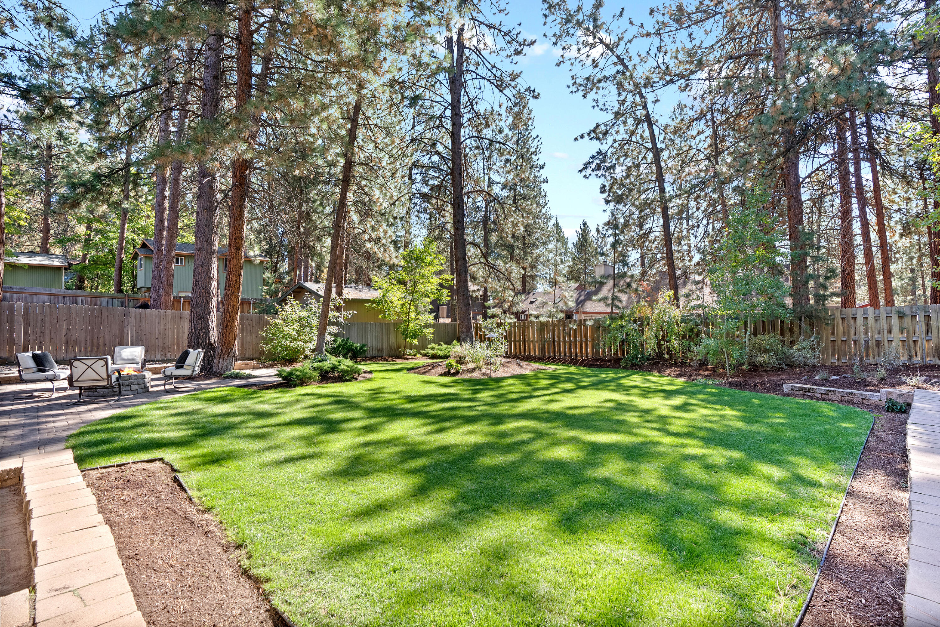 1961 Southwest Knoll Avenue Bend, OR 97702 - Photo 4 of 53 a backyard of a house with table and chairs