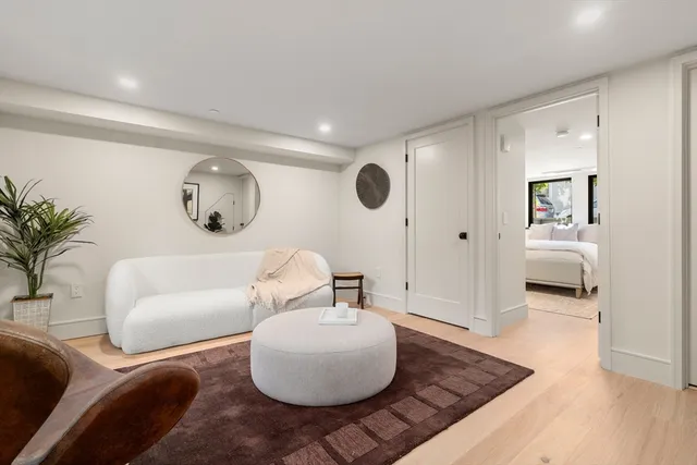 a large bedroom with a bed and a window